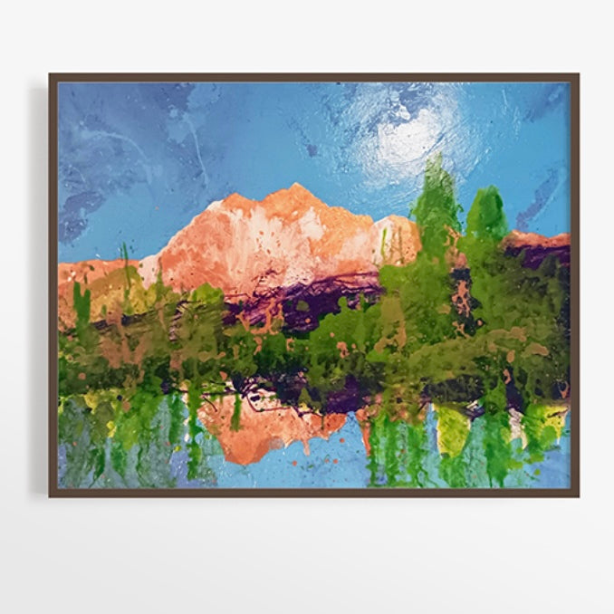 A colorful landscape painting featuring mountains, lush greenery, and a bright blue sky, with reflections in a serene water surface.