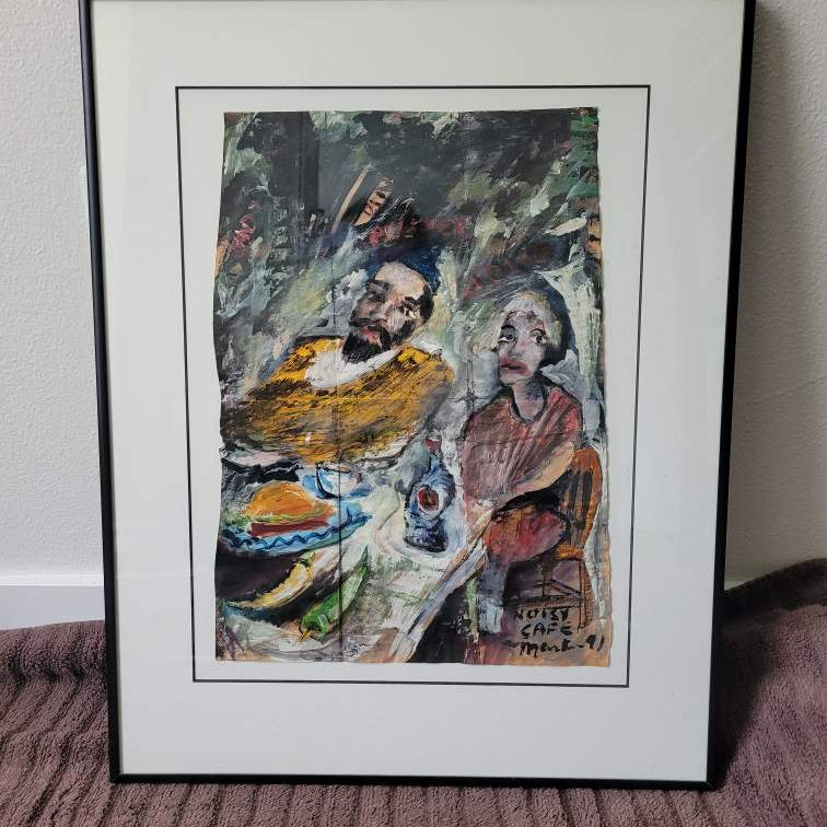 Framed artwork featuring two figures, one male and one female, seated at a table with food and a drink. Vibrant colors and expressive brushstrokes.