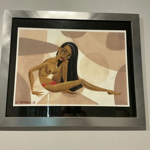 A framed illustration depicts a stylized figure lounging against a backdrop of soft, abstract shapes in warm tones. The figure has long hair and an expressive pose.