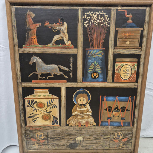 A framed artwork featuring a rustic display of various items: a bear, a horse, flowers, a coffee grinder, jars, and a doll adorned with a bonnet.