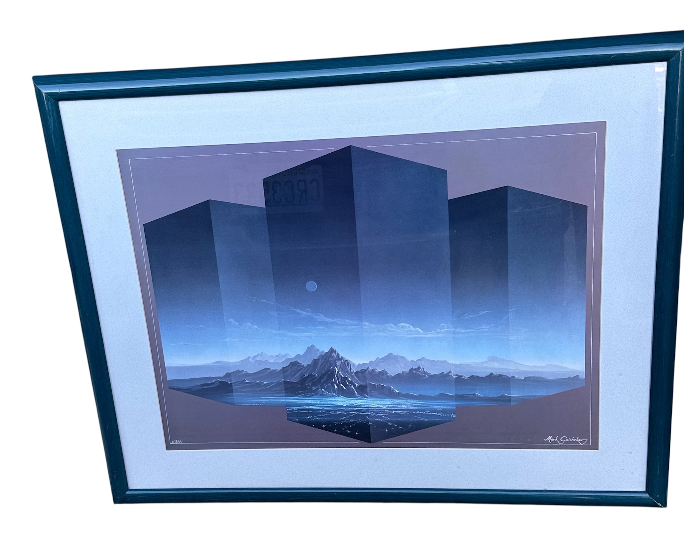 A framed artwork featuring geometric shapes in front of a serene landscape with mountains and water, evoking a tranquil, surreal atmosphere.