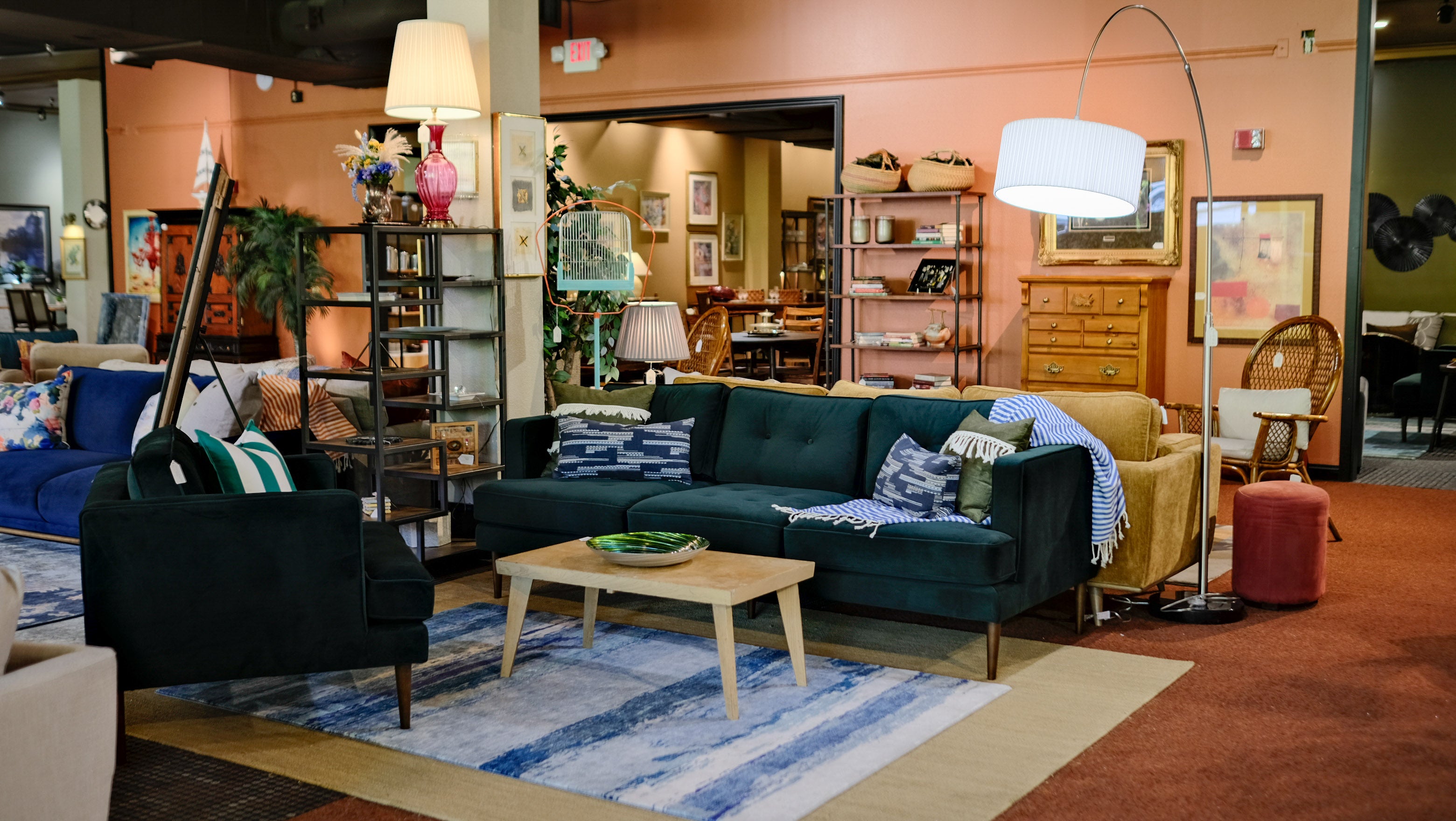 Green Tufted Velvet Sofa inside of a Tacoma Furniture Store. 