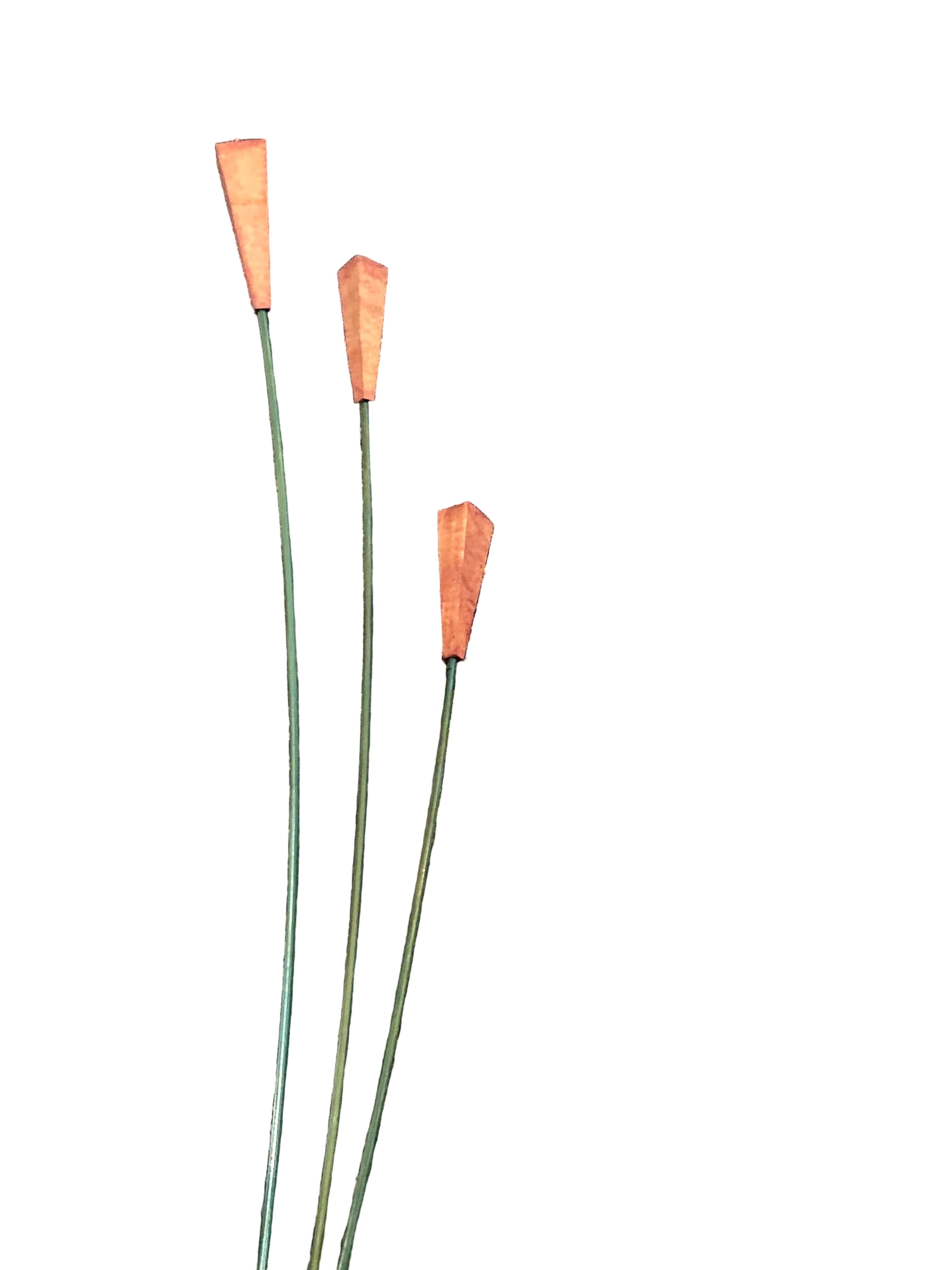 Three metal wire flower stems with orange-brown flower buds and green wire stems, arranged on a textured black and beige speckled surface.