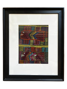 A framed artwork features two stylized fish against a colorful striped background, using vibrant colors and geometric patterns.