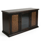 A dark brown wooden media console with carved bronze doors and a glass center door, shown on a white background.