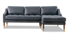 Brando is a modern sectional in blue leather. The chaise of the sectional, when you are facing the sectional, is on the right and the sofa portion is on the left. Walnut stained legs with gold tips toward the floor. The sofa fully upholstered and has swooping arms that taper from the back, down to the front. Both back and seat cushions are removable. The back cushion is smooth, the seat cushion is tufted. (facing front)