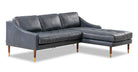 Brando is a modern sectional in blue leather. The chaise of the sectional, when you are facing the sectional, is on the right and the sofa portion is on the left. Walnut stained legs with gold tips toward the floor. The sofa fully upholstered and has swooping arms that taper from the back, down to the front. Both back and seat cushions are removable. The back cushion is smooth, the seat cushion is tufted. (facing front)