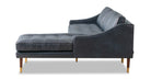 Brando is a modern sectional in blue leather. The chaise of the sectional, when you are facing the sectional, is on the right and the sofa portion is on the left. Walnut stained legs with gold tips toward the floor. The sofa fully upholstered and has swooping arms that taper from the back, down to the front. Both back and seat cushions are removable. The back cushion is smooth, the seat cushion is tufted. (facing side)