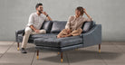 Room scene, man and woman sitting on Brando sectional sofa