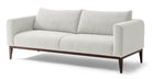 Colin is a modern sofa in textured white fabric. Fully upholstered with fixed seat cushions and removable back cushions. This sofa features a unique way the arms are curved inward. Full width solid stained Oak frame and legs supports the sofa. The wooden legs are all turned outwards to the floor for a more stability. (Front)