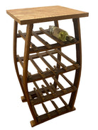 A wooden wine rack with a smooth top and several horizontal slats holds a wine bottle. It's positioned on a wooden floor near white doors.
