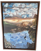 A framed painting depicting a serene landscape with swirling clouds, a reflective pond, and a solitary bird, resting on a mustard-colored couch.