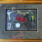 Full view of the artwork "Derriere Le Miroir" by Marc Chagall, featuring a colorful depiction of a red animal and various symbolic elements, framed in a golden ornate frame measuring 39.5" x 32".