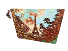 An artistic canvas featuring the Eiffel Tower, surrounded by vibrant autumn foliage and a colorful sky, set against a brick backdrop.