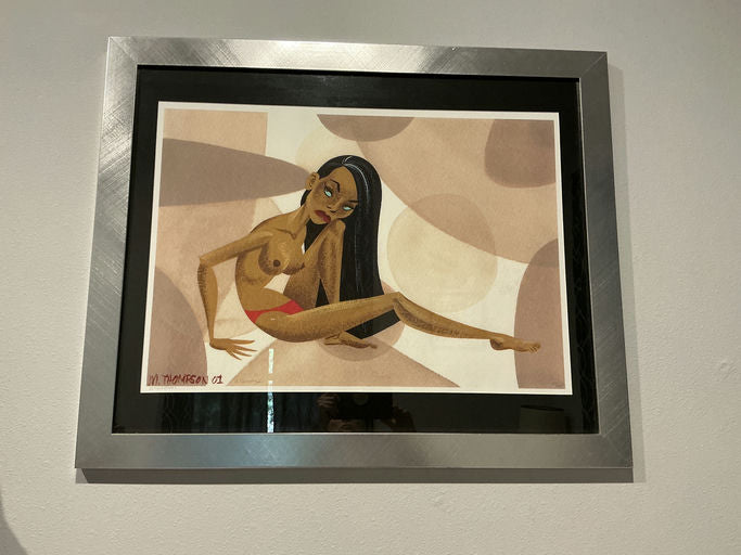 A framed illustration depicts a stylized figure lounging against a backdrop of soft, abstract shapes in warm tones. The figure has long hair and an expressive pose.