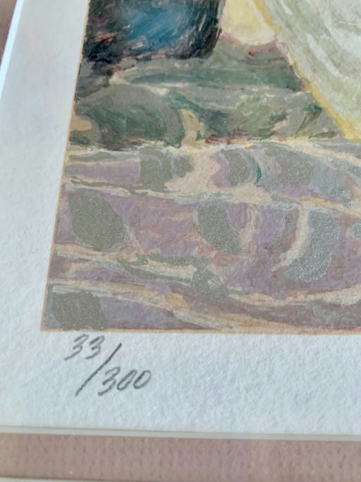 Close-up of an art print showing a signature and edition number "33/300" on textured paper, capturing details of the artwork's colors.