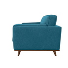 A side profile of the blue mid-century modern sofa, showing the depth of the seat cushions and the wooden legs from the side.