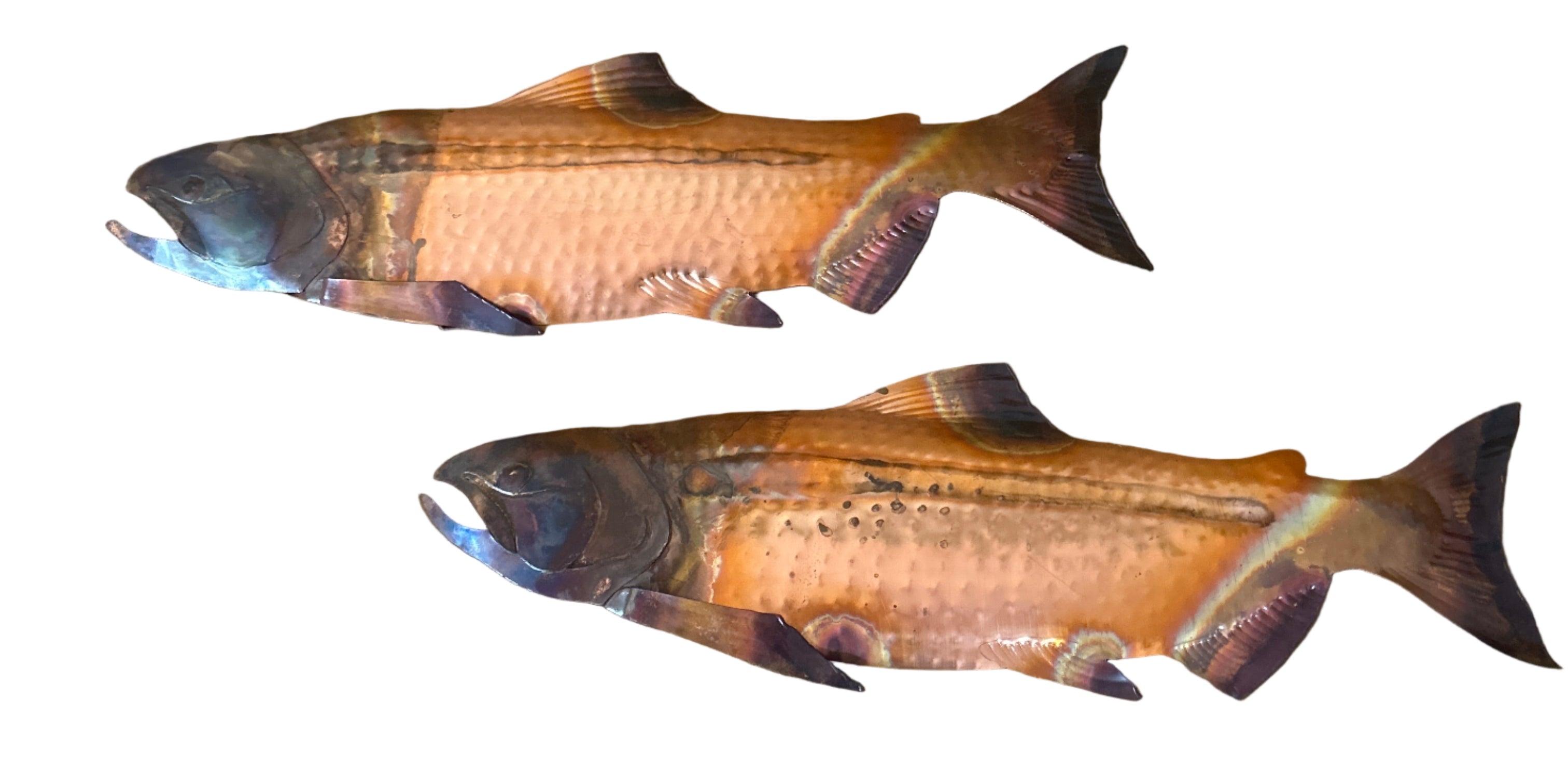 Two colorful fish-shaped plush toys resting on a mustard-colored tufted sofa, with patterned socks visible at the bottom of the image.