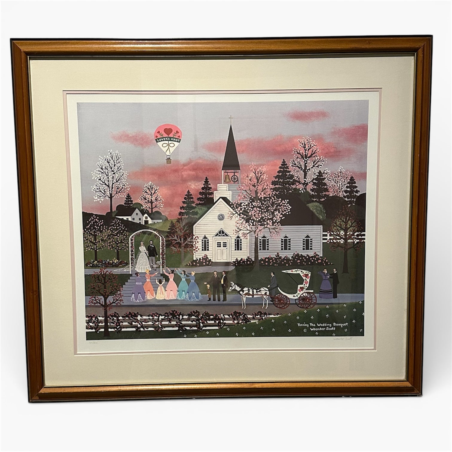 A framed illustration of a wedding scene outside a church, featuring a bride and groom, colorful bridesmaids, a horse-drawn carriage, and blossoming trees.