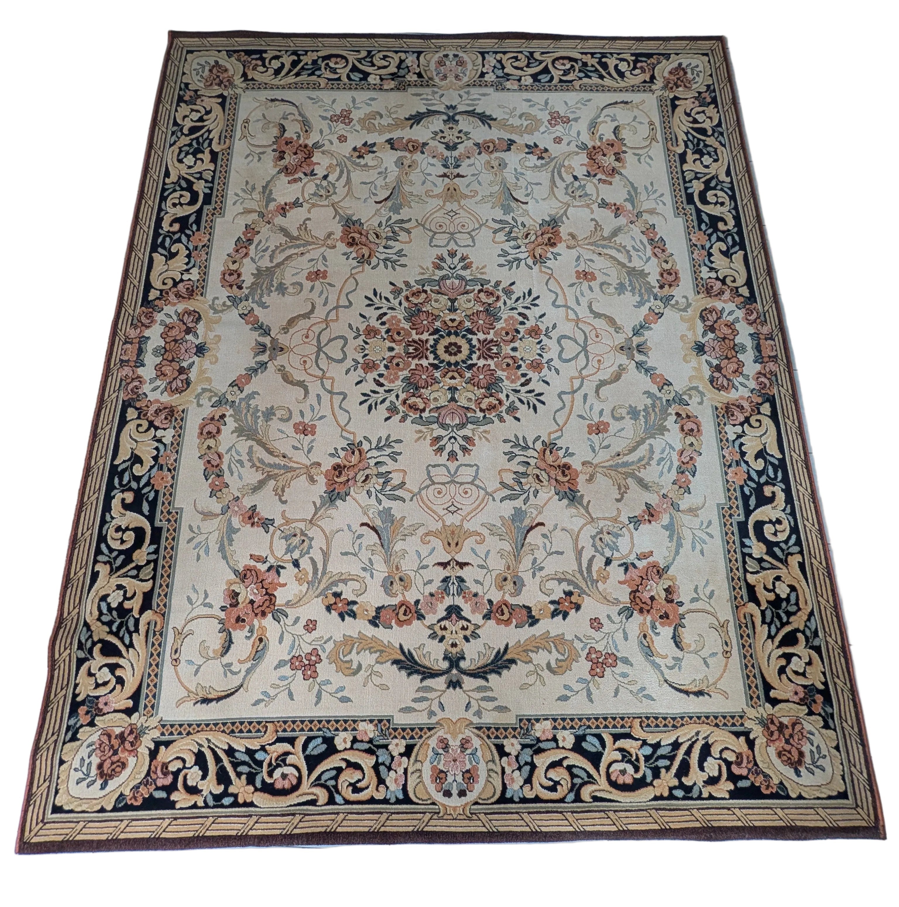 An overhead view of a decorative rug with floral patterns, placed on a tiled kitchen floor. A pair of feet in socks is visible at the bottom.