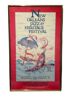 A vibrant poster for the New Orleans Jazz & Heritage Festival featuring a lobster and an umbrella, with event dates April 29 - May 8.