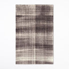 Textured area rug with a plaid pattern on a white background