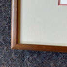 Close-up of the wooden frame corner of "Time" by Eng Tay.